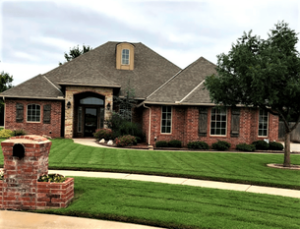 Picture-perfect front yard with thriving grass and a welcoming home
