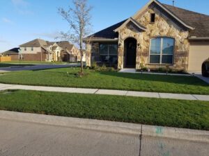 Charming home surrounded by a neatly manicured lawn